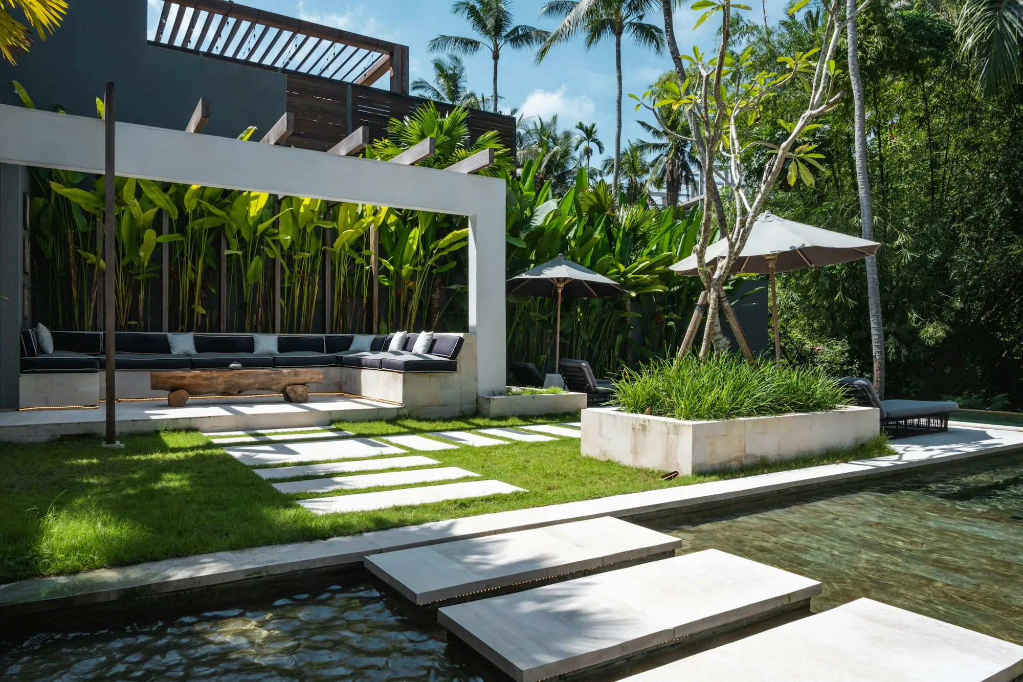 Modern architectural home opening onto a landscaped terrace